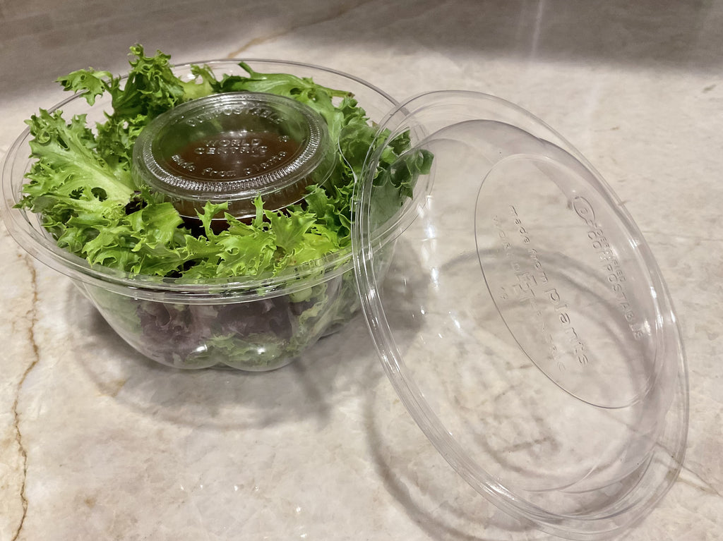 World Centric Compostable PLA 2 oz Clear Portion Cup with Salad Dressing