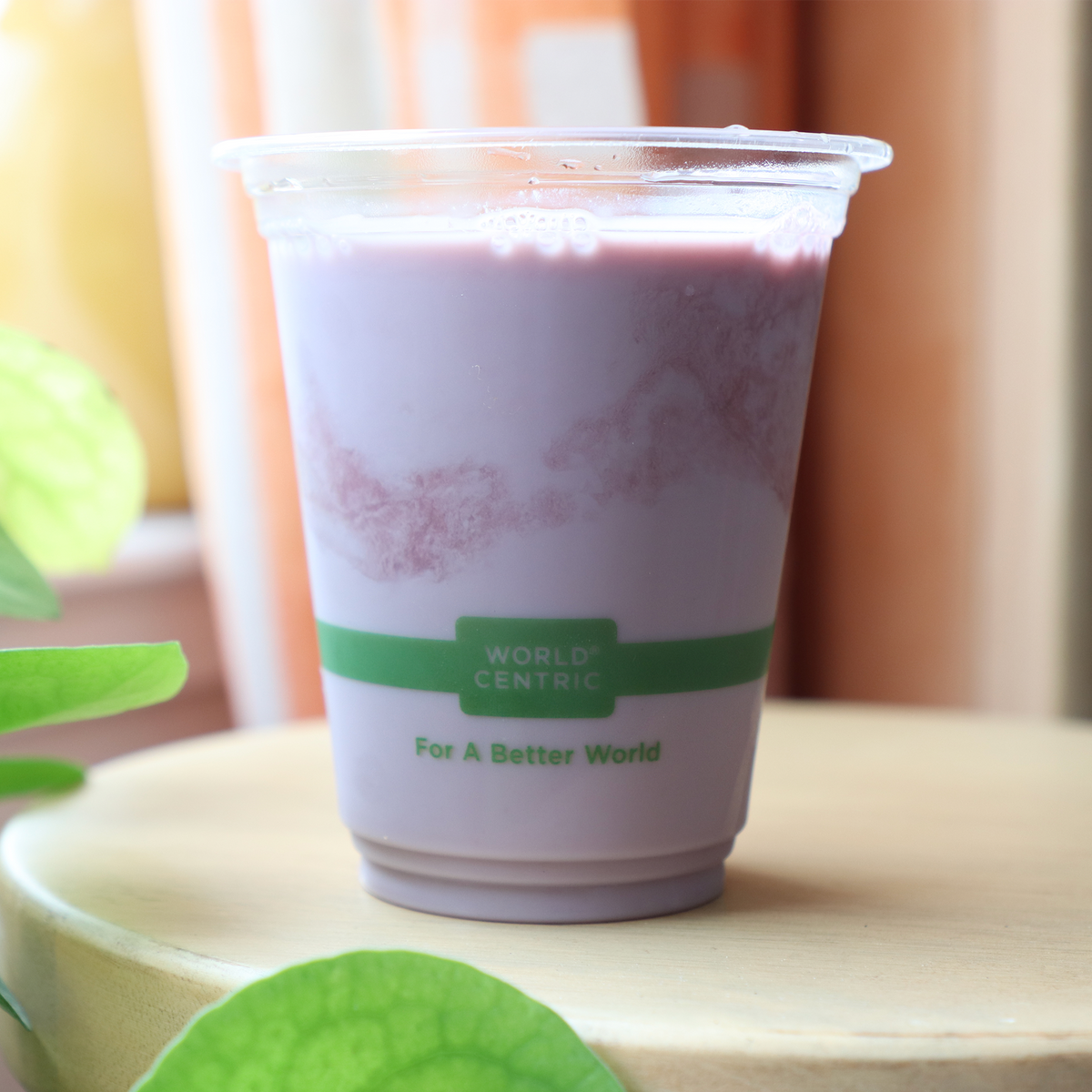 World Centric Compostable PLA 12 oz Clear Cold Cup shown with Smoothie.