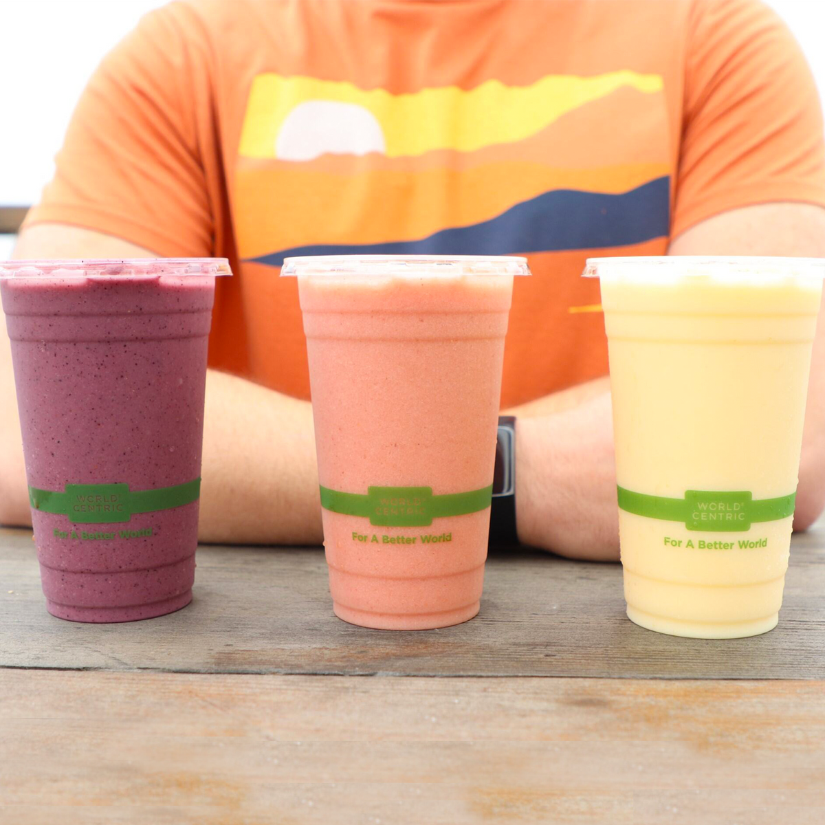 World Centric Compostable PLA 20 oz. Clear Cold Cups shown with beverage.