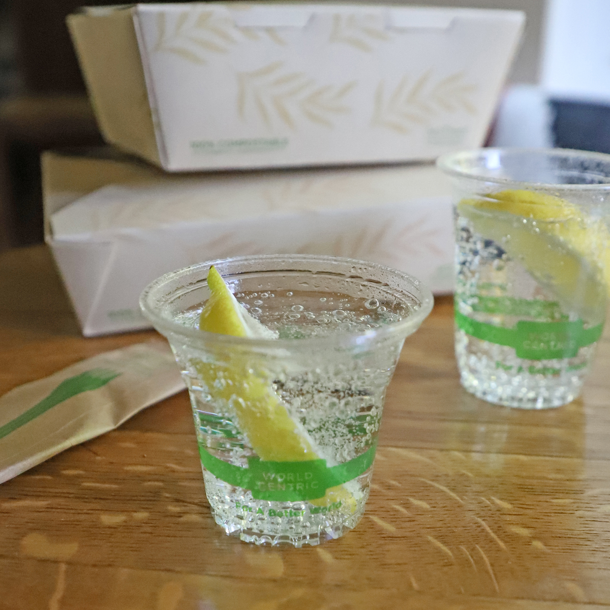 World Centric Compostable PLA 5 oz Clear Cold Cup shown with sparkling beverage.