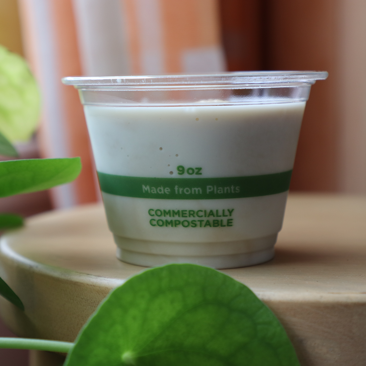 World Centric Compostable PLA Clear Cold Cup, 9 oz Squat, shown with beverage.