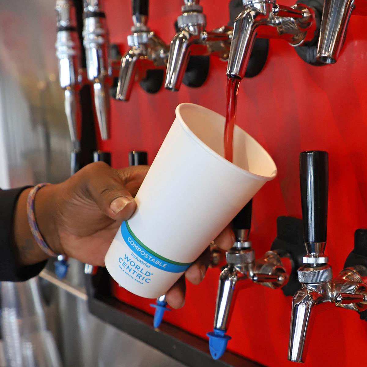 World Centric Compostable 16 oz NoTree Paper Cold Cup shown with a Soda Fountain.