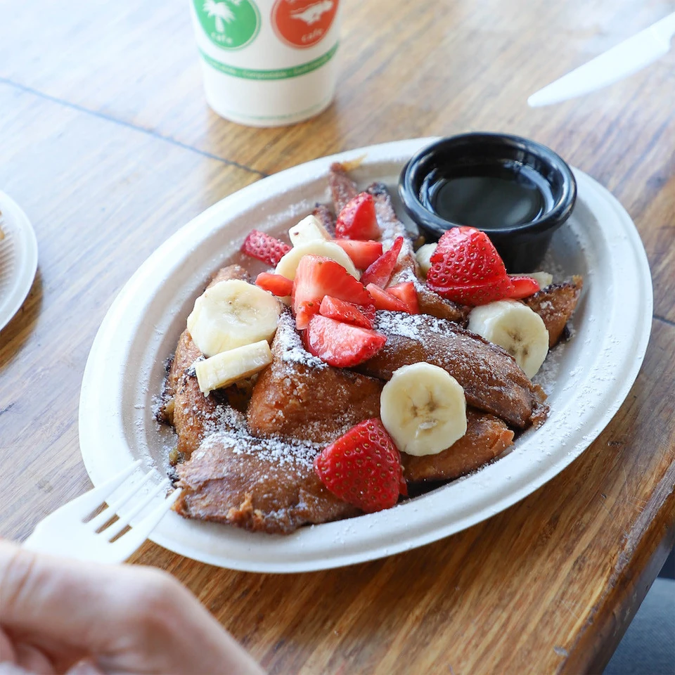 World Centric Compostable 10 inch oval fiber plate shown with pancakes and fruit
