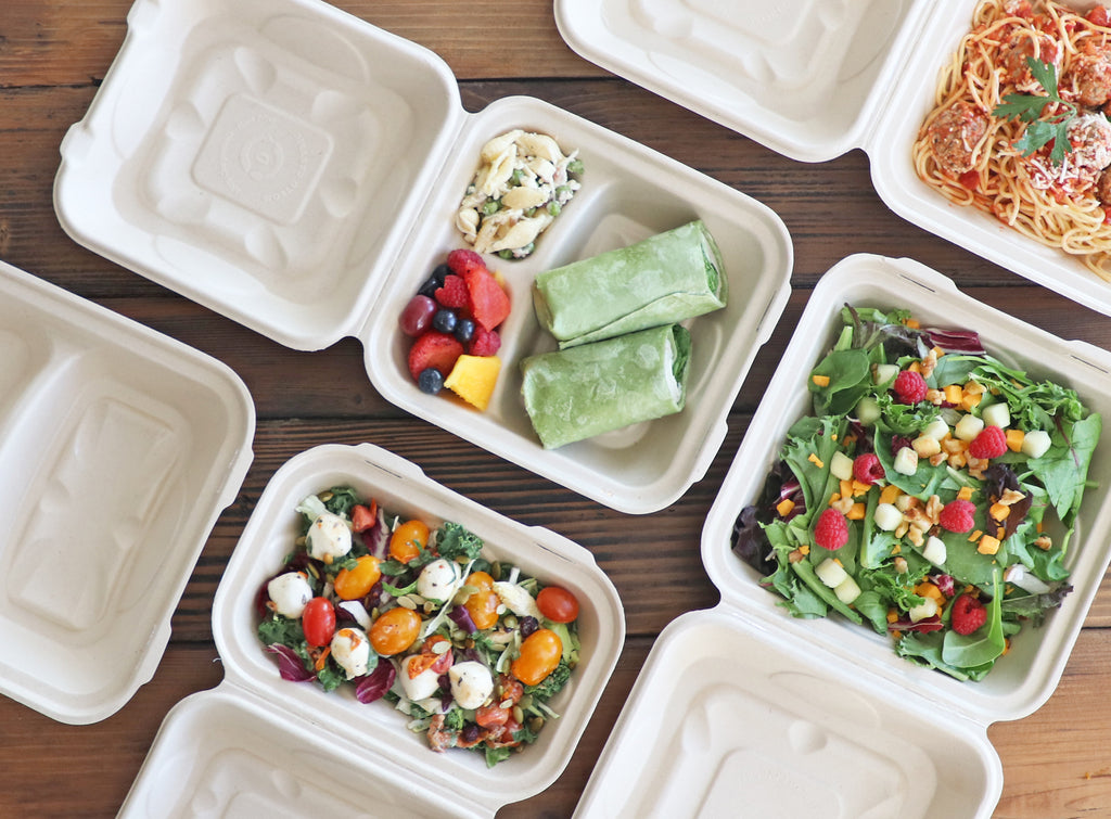 Assorted Compostable Clamshell Containers shown with food